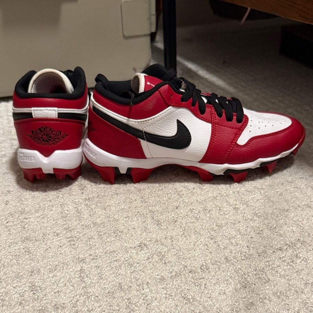 Red and white air jordan cleats